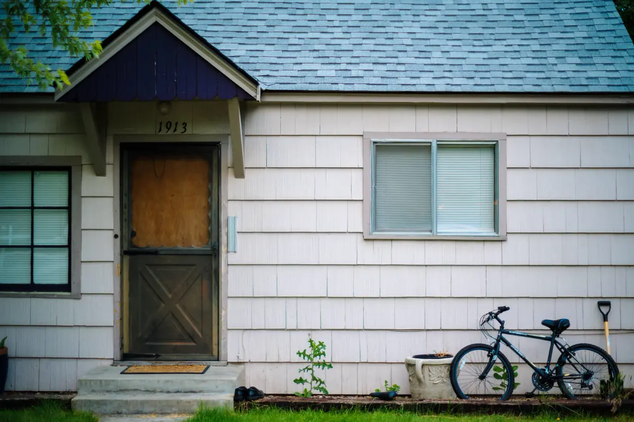 The front door of a suburban house in the afternoon.